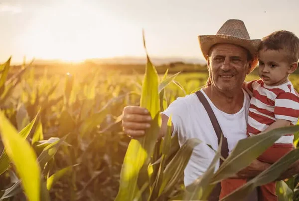 farmer and son in field
