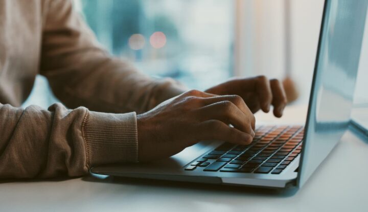 Cyber Liability Insurance Wisconsin person typing on computer