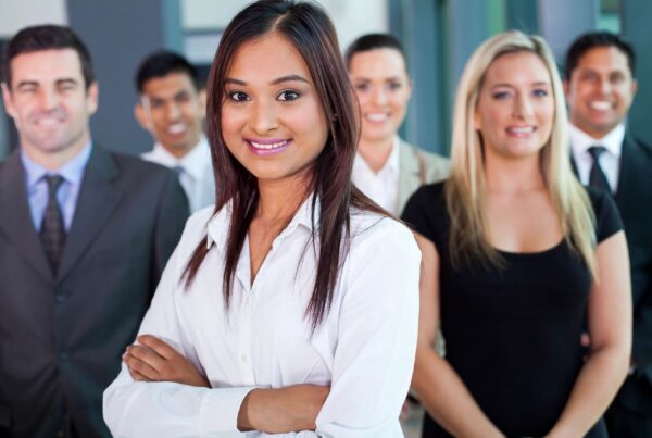 Employee Benefits Insurance WI business professionals smiling